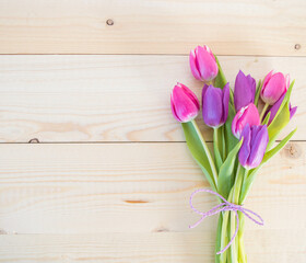 tulips on wooden ground with space for text