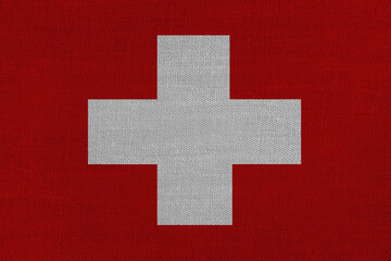 Obraz premium Patriotic textile background in colors of national flag. Switzerland