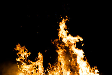 Fire flames on black background. fire burst texture for banner backdrop.