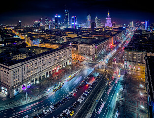 Constitution Square (PL: Plac Konstytucji) - a view of the center of night Warsaw with skyscrapers in the background - the lights of the big city by night, Poland, EU - obrazy, fototapety, plakaty