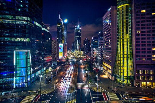 Fototapeta Beautiful panoramic aerial drone skyline view of the center of night Warsaw with skyscrapers in the background on avenues of John Paul II - the lights of the big city by night, Poland, EU