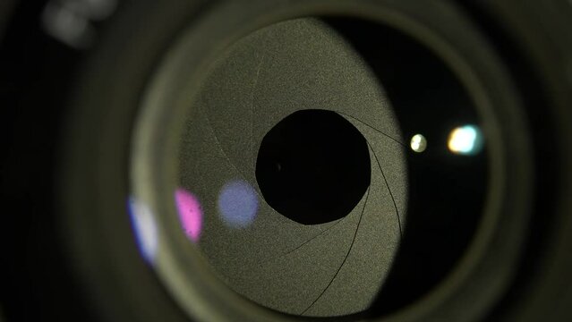 Macro close up shot of diaphragm of camera equipment. Opticel lens, focus device. Focal aperture concept, cinema, photography or videography concept. Iris of camera.