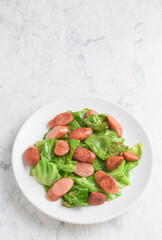 春キャベツとウインナーのバター炒め