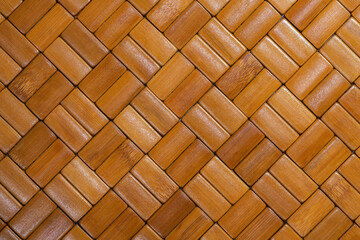 Bamboo brick mat texture. Brown tone bamboo placemat with a bricklike surface. Seamless wood pattern