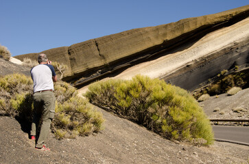 Man taking picture to the Tarta. Teide National Park. Tenerife. Canary Islands. Spain.