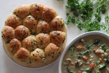 Dinner rolls with stewed chicken and vegetables