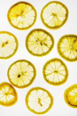 transparent round slices of lemon to the light