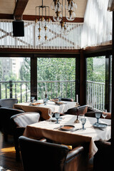 A beautifully laid table with exquisite dishes in a modern restaurant.