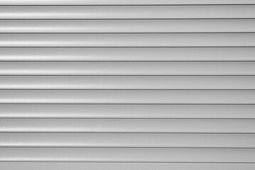 Obraz premium Roller blinds, gray horizontal metal roller shutters, close-up