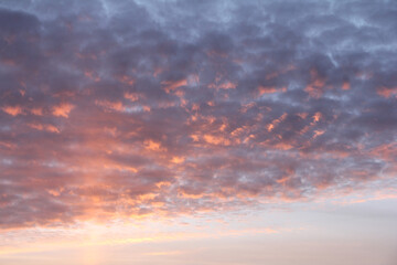 Volumetric clouds in the evening sky. At sunset. With the rays of the sun.