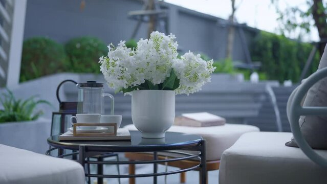 dolly shot of gazabo interior design,garden outdoor white armchair with coffee side table in white color theme stay in garden relax casual atmosphere ambient,home interior ideas design concept