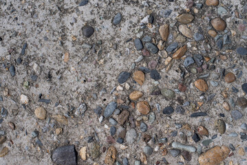 texture small cobblestone in concrete. Stone wall as a background or texture.