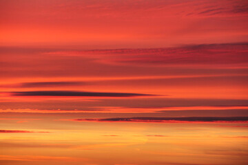 Sunset. Sky with clouds. With shades of pink and yellow.