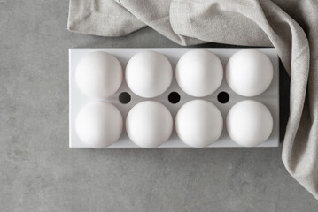 Easter eggs. Chicken white eggs on gray background. A chicken egg as a valuable nutritious product....