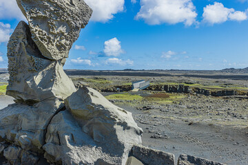 Lava stone rocks in a landscape of Iceland on the Reykjanes peninsula. Black lava sand with blades...