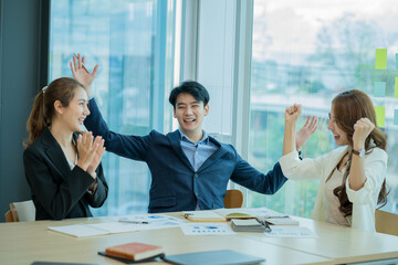 Businessman discussing initial projects A group of young Asian businessmen share ideas and propose new marketing and business ideas at the meeting.