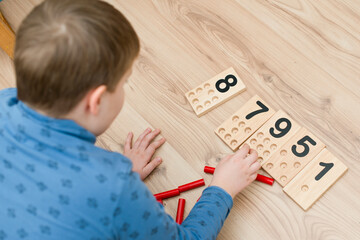 Wooden figures of the Montessori methodology. Math kids counting puzzle for kids. Educational training in computing games to develop. An intelligent children's math toy. Number game board.