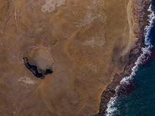 Old volcanic crater on Iceland. Top view of landscape of Reykjanes Peninsula. brown sand surface on...