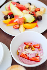 Breakfast with fresh fruits and yoghurt