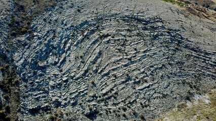 Various layers seen in rocks. Reflection of landforms on rocks. Shapes in rocks.