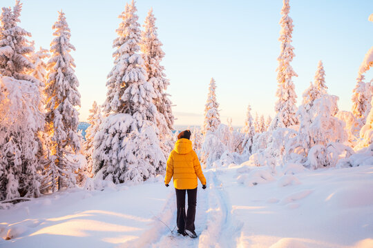 Young woman in winter forest in Finland