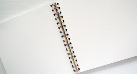 Open white spiral notebook, top view. Template, place for writing, for drawings, sketches.