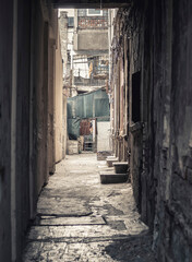 Dark narrow alley in the center of Bucharest, Romania