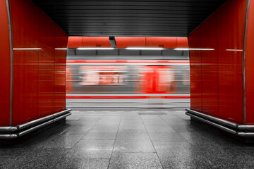 Illuminated underground metro station, public transport in Prague, Czech Republic, departing train...