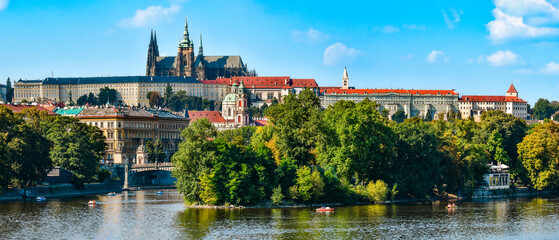 Hradcany, view from the Jiraskuv Bridge over the Vltava River on a sunny day.