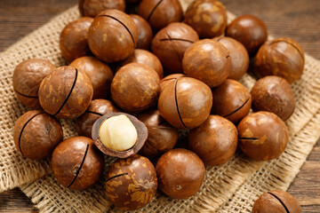 Macadamia nuts on a wooden table.
