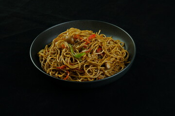 Spaghetti, pasta with tomato sauce and cherry tomatoes with basil on a dark background. Selective focus, copy space. shrimp spaghetti. 
