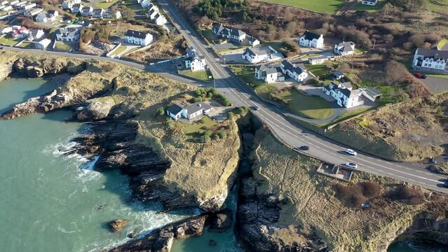 Aerial shot of the sunny rocky coast of Portnablagh, Co. Donegal, Ireland