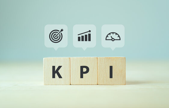 Banner KPI concept. Key Performance Indicator using business intelligence metrics to measure achievement versus planned target.  Wooden cubes with "KPI" abbreviation and symbols on smart background.
