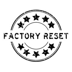 Grunge black factory reset word with star icon round rubber seal stamp on white background