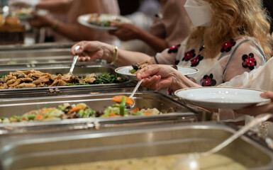 scooping the food, catering, dinner time