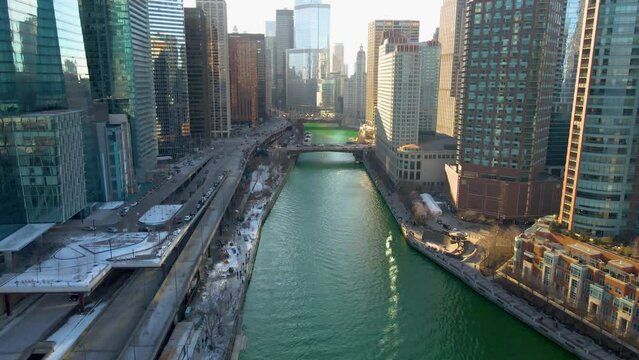 Chicago, IL USA- march 13th 2022: aerial drone shot of downtown Chicago by the river during early spring summer.  the beautiful skyscrapers look futuristic  along the green lake water