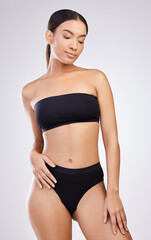 Fototapeta premium Bring out the bikinis, my body is ready. Studio shot of a beautiful young woman posing against a white background.