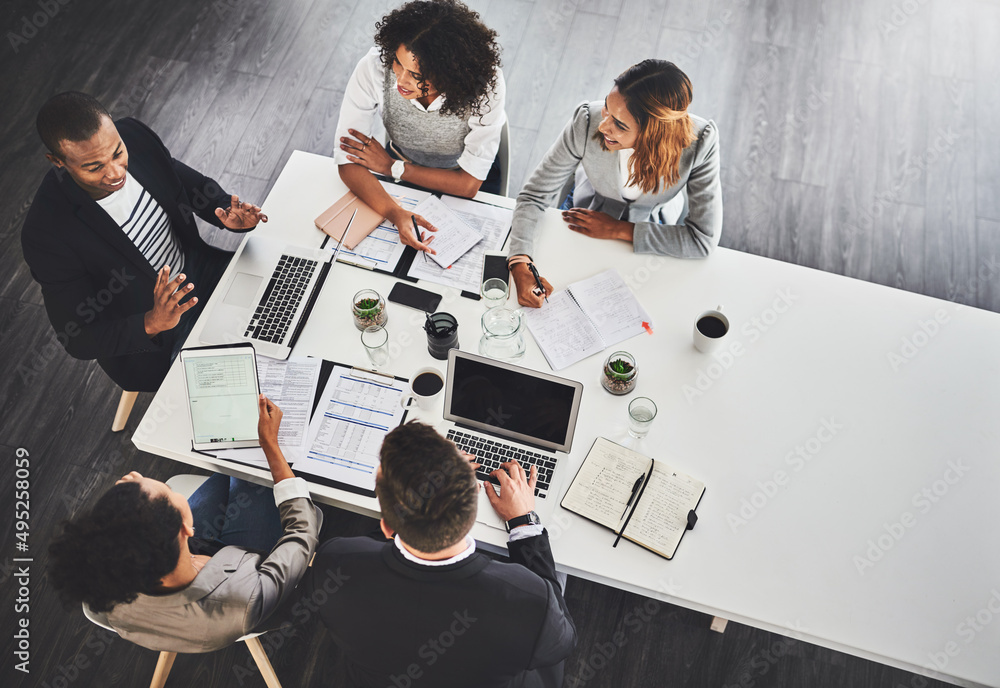 Wall mural theyre the best team to keep building on success. high angle shot of a group of businesspeople havin