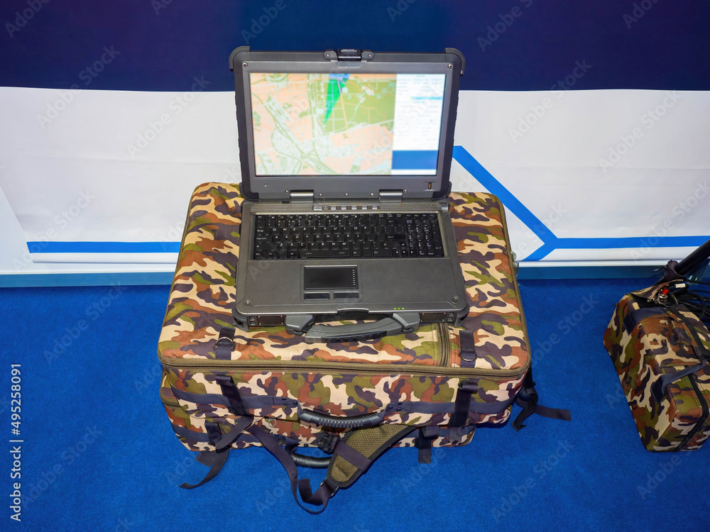 Poster army laptop with accessories. equipment for a military topographer. secure laptop with a map on the 