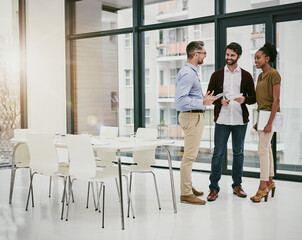 The meeting of the best minds in business. Shot of a group of colleagues having a meeting in a modern office.