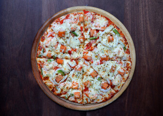 Seafood Italian Pizza on wood background top view with copy space.