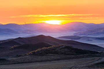 Beautiful natural landscape in Ulan Butong grassland, Inner Mongolia, China. Colorful grassland and mountain scenery in autumn season.