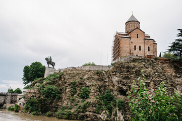 Fototapeta premium Ancient fortress Narikala Fortress with the St Nikolas church or Metekhi st Virgin Church in the old town of Tbilisi, Republic of Georgia, Caucasus.