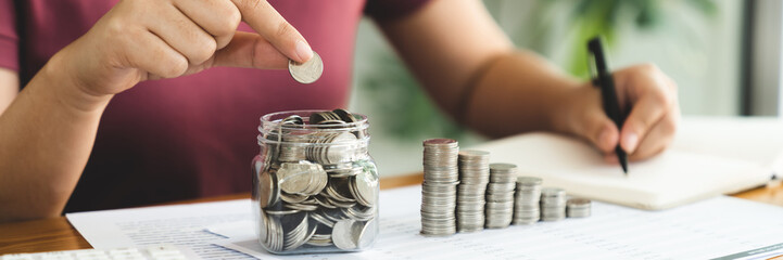 Woman with coin stack. Financial Growing savings concept. Saving money by hand putting coins money accounting planning