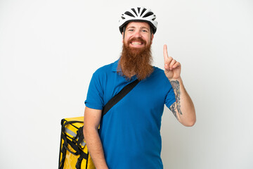 Young reddish caucasian man with thermal backpack isolate don white background pointing up a great idea
