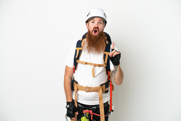 Young rock- climber reddish caucasian man isolated on white background intending to realizes the solution while lifting a finger up