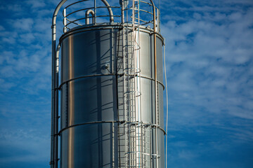 Stainless steel silos in the chemical industry, bulk plastics silo against