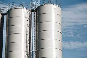 Stainless steel silos in the chemical industry, bulk plastics silo against