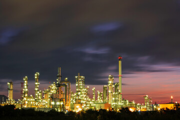 Fototapeta na wymiar Oil​ refinery​ and​ plant and tower column of Petrochemistry industry in pipeline oil​ and​ gas​ ​industry with​ cloud​ slowing red sky