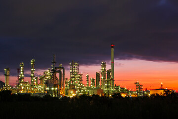 Oil​ refinery​ and​ plant and tower column of petrochemistry industry in pipeline oil​ and​ gas​ ​industry with​ sun red sky the morning